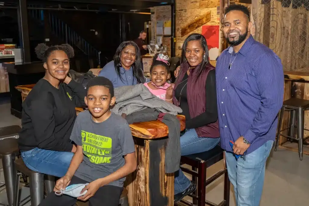 Family celebrating a birthday with axe throwing in Springfield