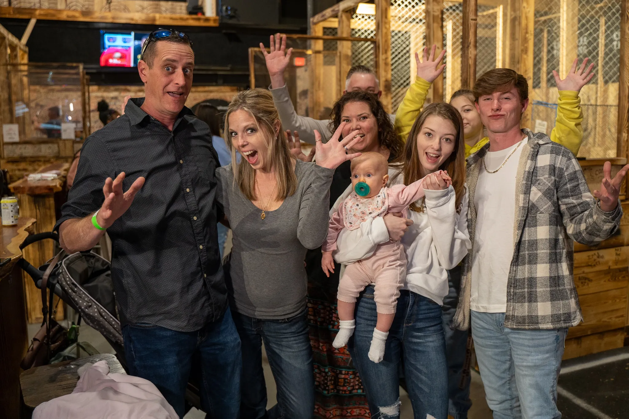 Family enjoying an axe throwing outing together